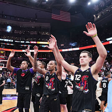 Apr 9, 2025; Toronto, Ontario, CAN; Toronto Raptors forward Scottie Barnes (4) and guard A.J. Lawson (0) acknowledge the crowd after a game against the Charlotte Hornets at Scotiabank Arena. Mandatory Credit: Nick Turchiaro-Imagn Images