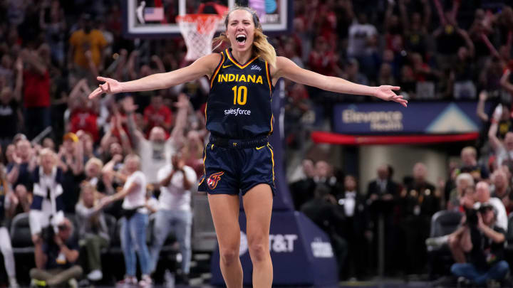 Indiana Fever guard Lexie Hull (10) celebrates after scoring a three-point field goal during the second half of a game against the Seattle Storm on Sunday, Aug. 18, 2024, at Gainbridge Fieldhouse in Indianapolis. The Fever defeated the Storm 92-75.