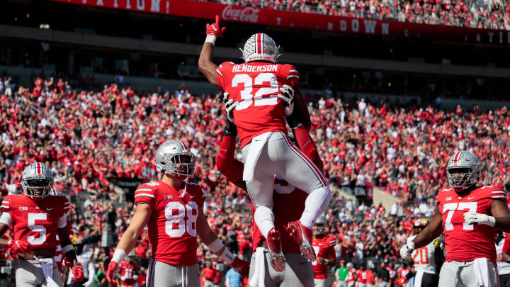 Ohio State Buckeyes running back TreVeyon Henderson (32) celebrates with teammates after scoring a