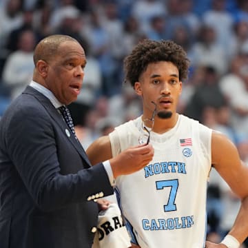 Nov 7, 2025; Chapel Hill, North Carolina, USA;  North Carolina Tar Heels head coach Hubert Davis with guard Seth Trimble (7) in the second half at Dean E. Smith Center. Mandatory Credit: Bob Donnan-Imagn Images