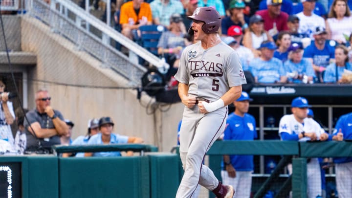 Jun 17, 2024; Omaha, NE, USA; Texas A&M Aggies designated hitter Hayden Schott (5) celebrates as he scores a run against the Kentucky Wildcats during the sixth inning at Charles Schwab Field Omaha. Mandatory Credit: Dylan Widger-USA TODAY Sports