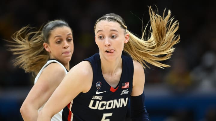 Connecticut Huskies guard Paige Bueckers dribbles the ball against the Iowa Hawkeyes in the semifinals of the Final Four of the 2024 NCAA Women's Tournament at Rocket Mortgage FieldHouse.