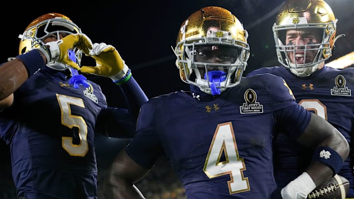 Notre Dame Fighting Irish running back Jeremiyah Love (4) celebrates after scoring a touchdown during the first half of a game between the Indiana Hoosiers and the Notre Dame Fighting Irish in first round of the College Football Playoff on Friday, Dec. 20, 2024, in South Bend.