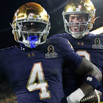 Notre Dame Fighting Irish running back Jeremiyah Love (4) celebrates after scoring a touchdown during the first half of a game between the Indiana Hoosiers and the Notre Dame Fighting Irish in first round of the College Football Playoff on Friday, Dec. 20, 2024, in South Bend.