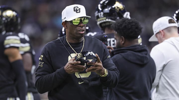 Dec 28, 2024; San Antonio, TX, USA; Colorado Buffaloes head coach Deion Sanders walks on the field between plays during the first quarter against the Brigham Young Cougars at Alamodome. Mandatory Credit: Troy Taormina-Imagn Images Dec 28, 2024; San Antonio, TX, USA; Colorado Buffaloes head coach Deion Sanders walks on the field between plays during the first quarter against the Brigham Young Cougars at Alamodome. Mandatory Credit: Troy Taormina-Imagn Images