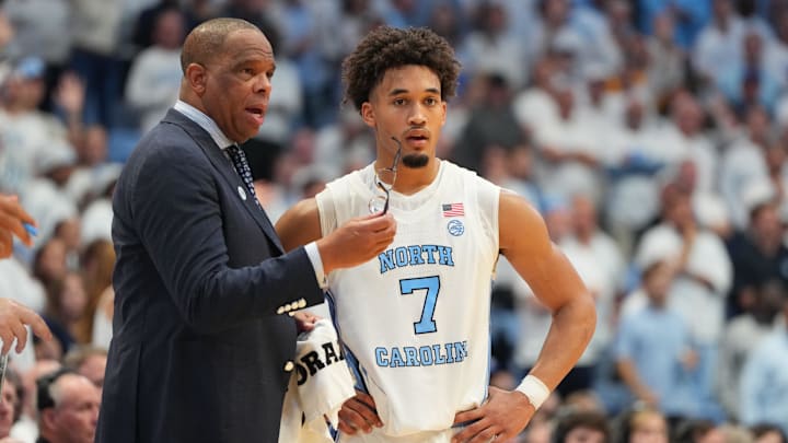 Nov 7, 2025; Chapel Hill, North Carolina, USA;  North Carolina Tar Heels head coach Hubert Davis with guard Seth Trimble (7) in the second half at Dean E. Smith Center. Mandatory Credit: Bob Donnan-Imagn Images