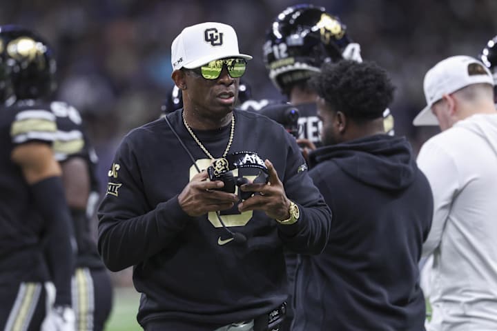 Colorado Buffaloes head coach Deion Sanders walks on the field between plays during the first quarter against BYU. 