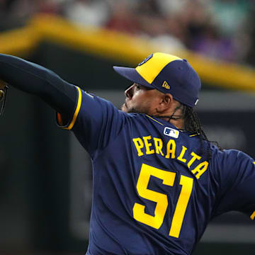 Milwaukee Brewers pitcher Freddy Peralta (51) pitches against the Arizona Diamondbacks USA; during the first inning at Chase Field on Sept 13.