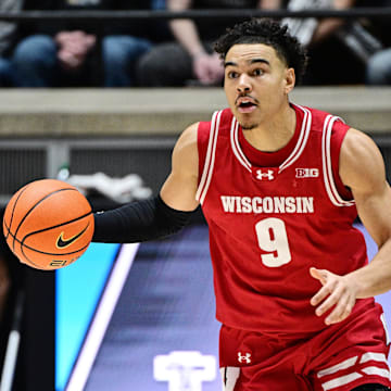 Feb 15, 2025; West Lafayette, Indiana, USA; Wisconsin Badgers guard John Tonje (9) dribbles the ball down the court during the first half against the Purdue Boilermakers at Mackey Arena. Mandatory Credit: Marc Lebryk-Imagn Images