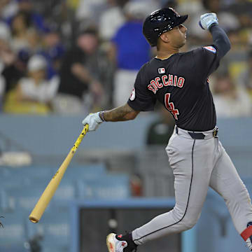 Sep 6, 2024; Los Angeles, California, USA;  Cleveland Guardians shortstop Brayan Rocchio (4) hits a solo home run in the eighth inning against the Los Angeles Dodgers at Dodger Stadium. Mandatory Credit: Jayne Kamin-Oncea-Imagn Images