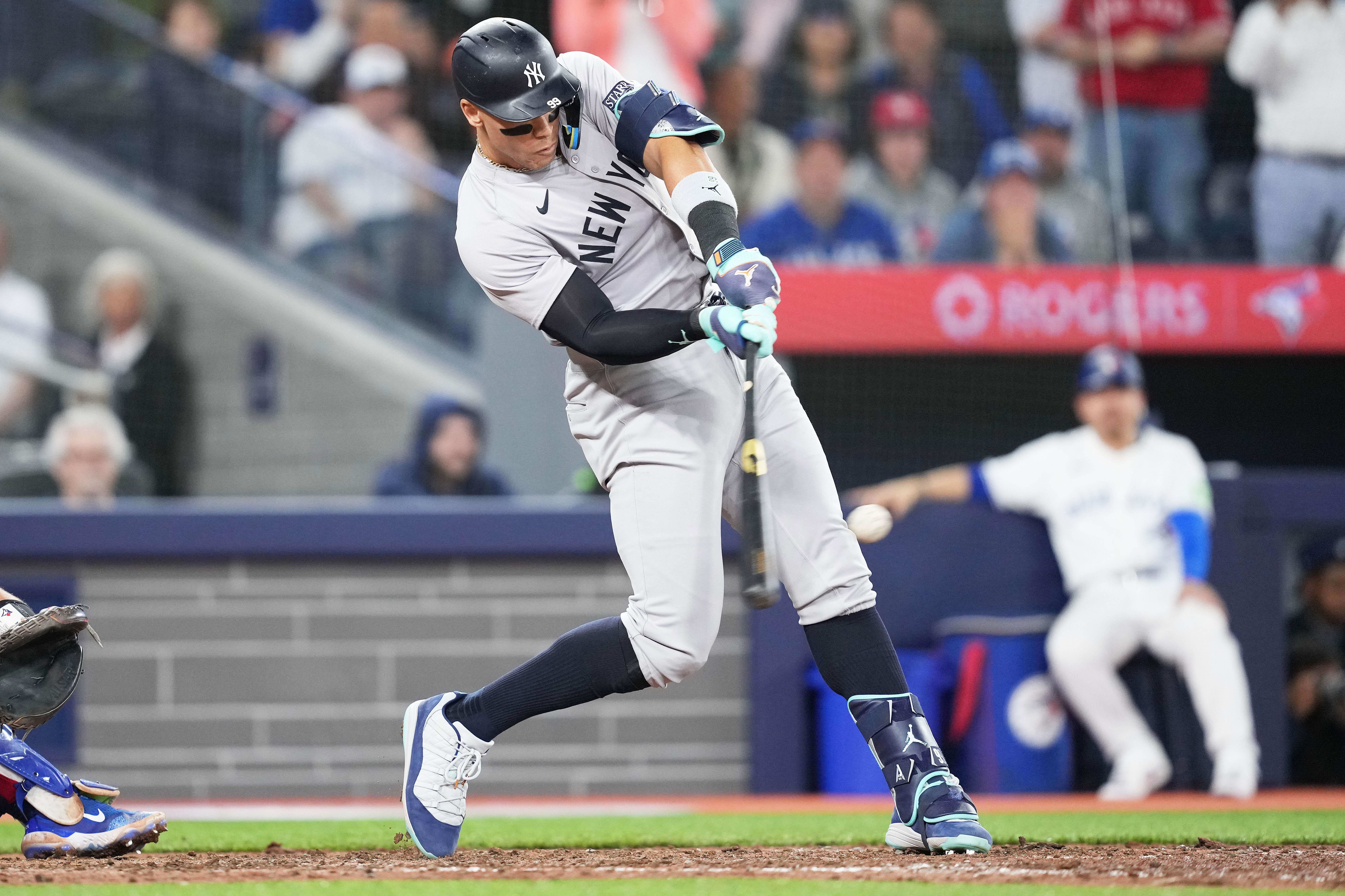 New York Yankees outfielder Aaron Judge hits a home run.