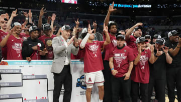 Mar 30, 2024; Los Angeles, CA, USA;  The Alabama Crimson Tide celebrate on the podium after defeating the Clemson Tigers in the finals of the West Regional of the 2024 NCAA Tournament at Crypto.com Arena.