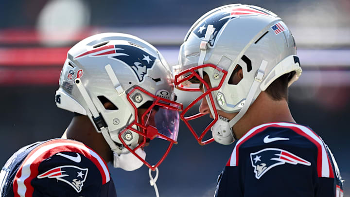 Sep 15, 2024; Foxborough, Massachusetts, USA; New England Patriots quarterback Drake Maye (10) and wide receiver Ja'Lynn Polk (1) talk before a game against the Seattle Seahawks at Gillette Stadium. Mandatory Credit: Brian Fluharty-Imagn Images