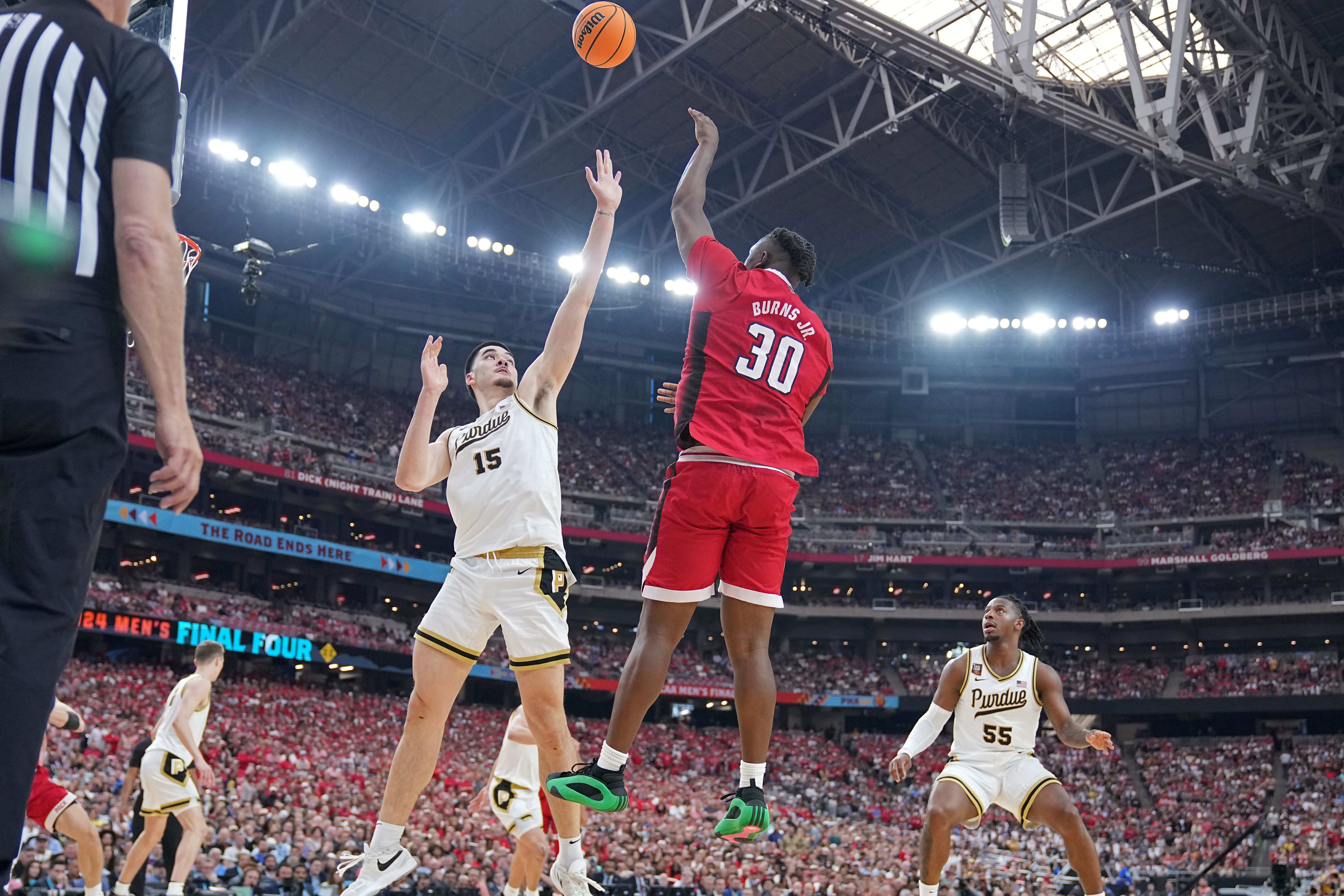 North Carolina State Wolfpack forward DJ Burns shoots the ball.