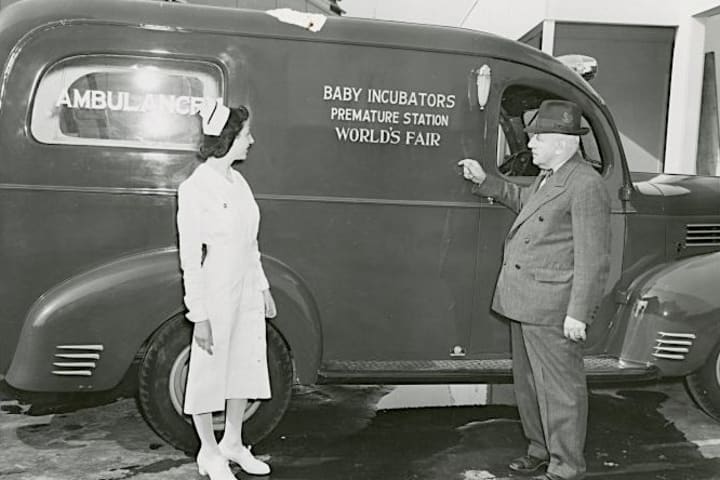 Martin Couney and a nurse with Couney's baby ambulance.