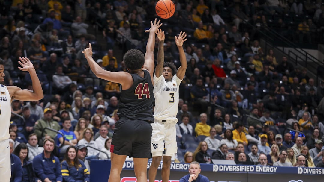 Nov 17, 2025; Morgantown, West Virginia, USA; West Virginia Mountaineers guard Honor Huff (3) shoots a three-point shot over Lafayette Leopards forward Shareef Jackson (44) during the second half at WVU Coliseum. Mandatory Credit: Ben Queen-Imagn Images
