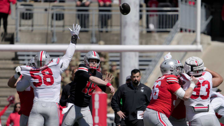 April 13, 2024; Columbus, Ohio, USA; 
Ohio State Buckeyes quarterback Will Howard (18) thorws a pass while playing for the scarlet team during the first half of the LifeSports spring football game at Ohio Stadium on Saturday.