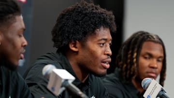 Bearcats new transfer defensive backs (left to right) Kye Stokes, Jared Bartlett and Derrick Canteen take questions during a press conference at the University of Cincinnati   s Fifth Third Arena in Cincinnati on Tuesday, Feb. 13, 2024.