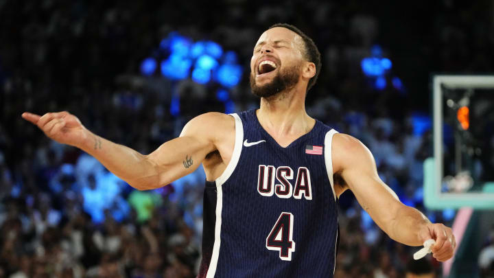 Aug 10, 2024; Paris, France; United States guard Stephen Curry (4) celebrates after defeating France in the men's basketball gold medal game during the Paris 2024 Olympic Summer Games at Accor Arena. 