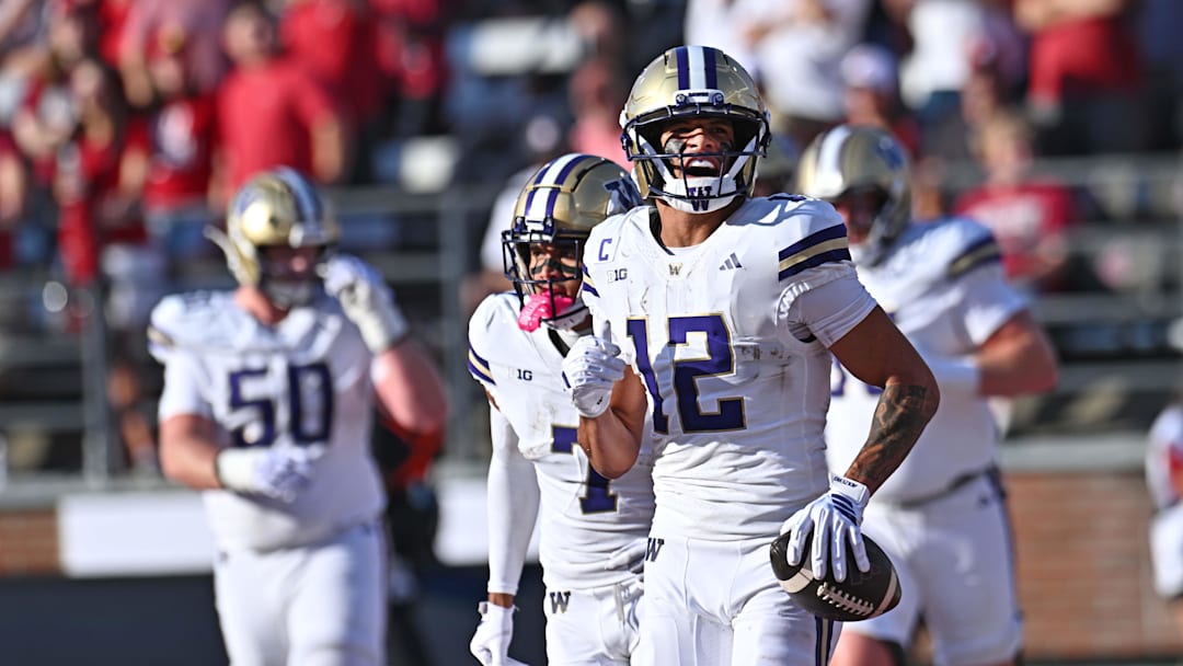 Sep 20, 2025; Pullman, Washington, USA; Washington Huskies wide receiver Denzel Boston (12) celebrate a touchdown against the Washington State Cougars in the first half of Apple Cup at Gesa Field at Martin Stadium. Mandatory Credit: James Snook-Imagn Images