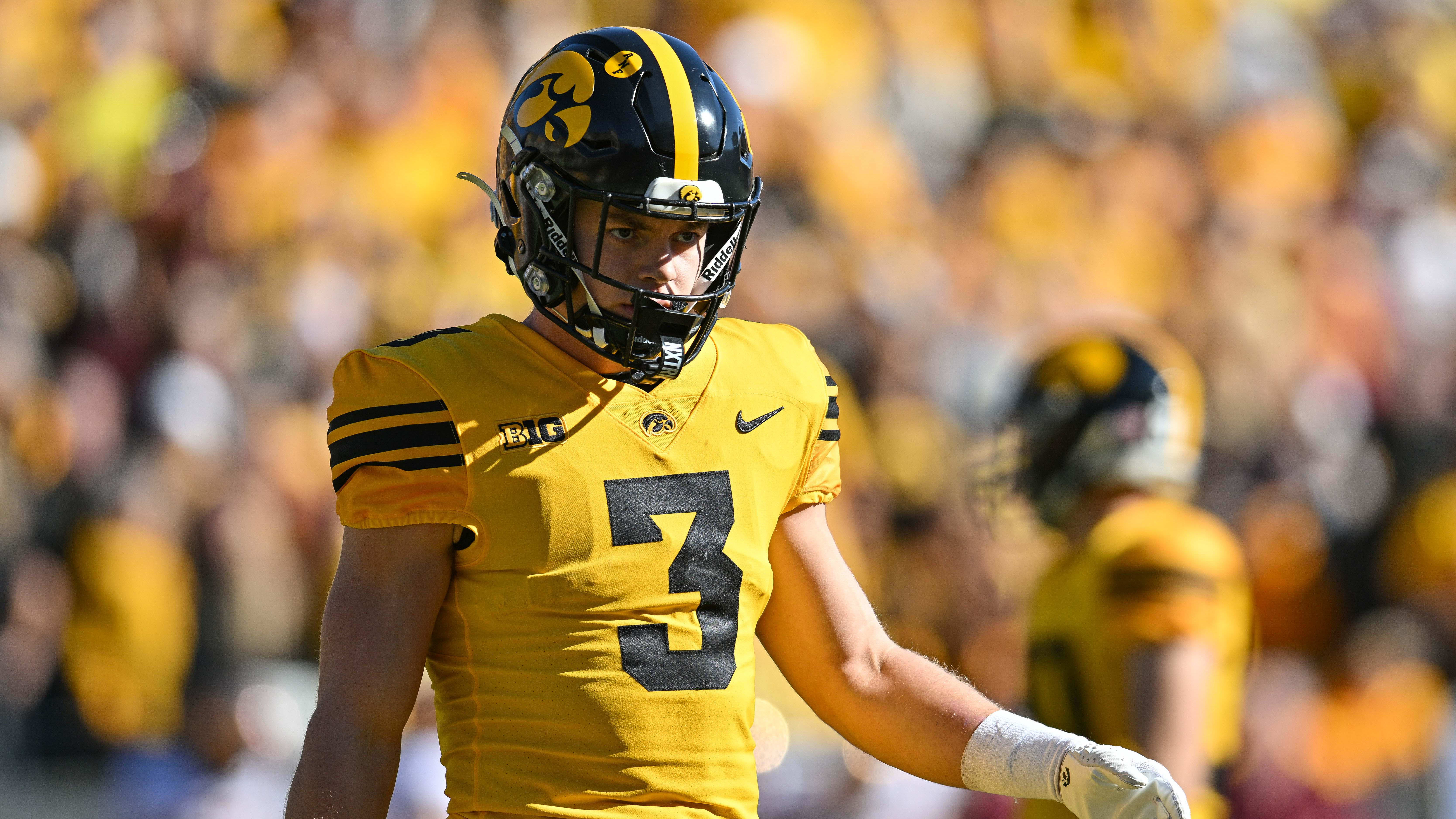 Iowa Hawkeyes defensive back Cooper DeJean looks on during a game.