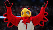 Mar 20, 2025; Lexington, KY, USA; The Louisville Cardinals mascot cheers during the second half against the Creighton Bluejays in the first round of the NCAA Tournament at Rupp Arena. Mandatory Credit: Aaron Doster-Imagn Images
