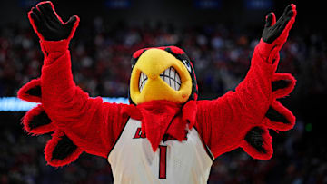 Mar 20, 2025; Lexington, KY, USA; The Louisville Cardinals mascot cheers during the second half against the Creighton Bluejays in the first round of the NCAA Tournament at Rupp Arena. Mandatory Credit: Aaron Doster-Imagn Images