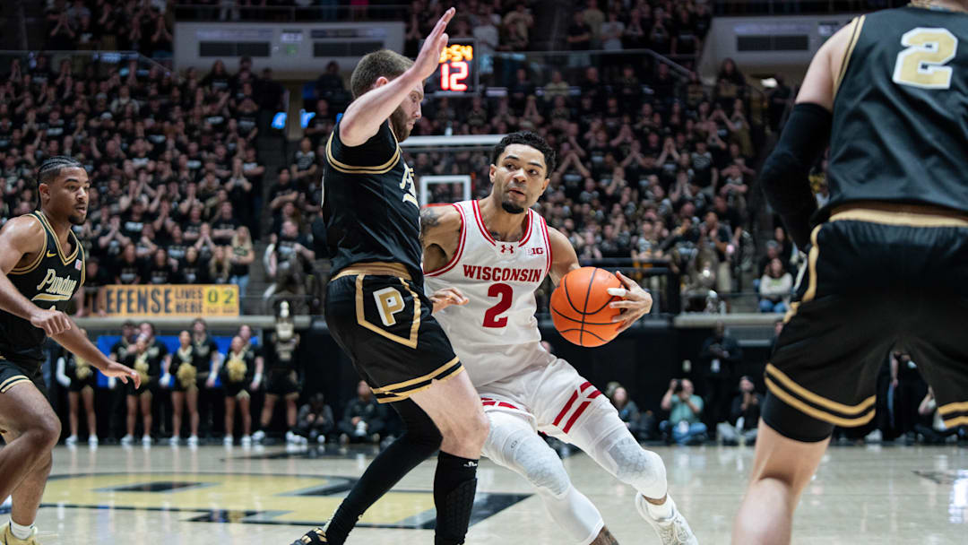 Mar 7, 2026; West Lafayette, Indiana, USA; Wisconsin Badgers guard Nick Boyd (2) drives to the basket as Purdue Boilermakers guard Braden Smith (3) defends during the first half at Mackey Arena. Mandatory Credit: Jacob Musselman-Imagn Images