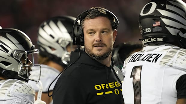 Oregon Ducks head coach Dan Lanning looks on during the third quarter against the Wisconsin Badgers at Camp Randall Stadium.