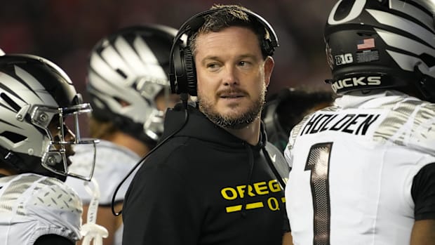 Nov 16, 2024; Madison, Wisconsin, USA;  Oregon Ducks head coach Dan Lanning looks on during the third quarter against the Wis