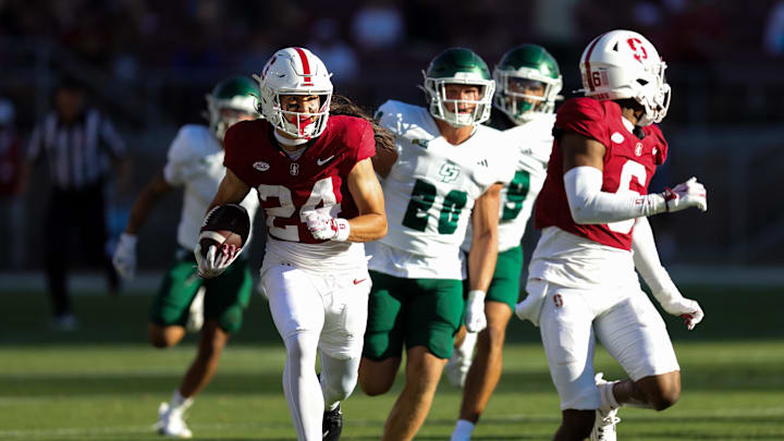 Sep 7, 2024; Stanford, California, USA; Stanford Cardinal wide receiver Tiger Bachmeier (24) returns a punt for a touchdown against the Cal Poly Mustangs during the second half at Stanford Stadium. Mandatory Credit: Sergio Estrada-Imagn Images