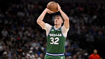 Oct 26, 2025; Dallas, Texas, USA; Dallas Mavericks forward Cooper Flagg (32) makes a three-point shot against the Toronto Raptors during the second half at the American Airlines Center.