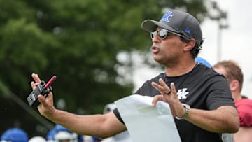 New Kentucky offensive coordinator Bush Hamdan coaches during practice Friday. August 2, 2024 in Lexington. Hamdan came from Boise State; he's also coached at Missouri, the Atlanta Falcons and Florida as well.