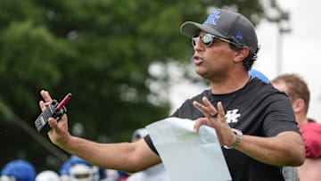 New Kentucky offensive coordinator Bush Hamdan coaches during practice Friday. August 2, 2024 in Lexington. Hamdan came from Boise State; he's also coached at Missouri, the Atlanta Falcons and Florida as well.