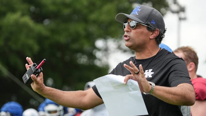 New Kentucky offensive coordinator Bush Hamdan coaches during practice Friday. August 2, 2024 in Lexington. Hamdan came from Boise State; he's also coached at Missouri, the Atlanta Falcons and Florida as well.