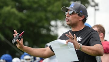 New Kentucky offensive coordinator Bush Hamdan coaches during practice Friday. August 2, 2024 in Lexington. Hamdan came from Boise State; he's also coached at Missouri, the Atlanta Falcons and Florida as well.