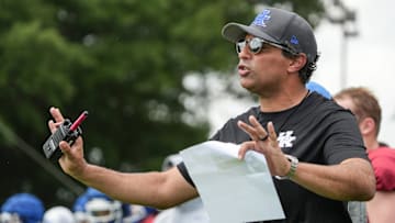 New Kentucky offensive coordinator Bush Hamdan coaches during practice Friday. August 2, 2024 in Lexington. Hamdan came from Boise State; he's also coached at Missouri, the Atlanta Falcons and Florida as well.