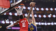 Apr 23, 2025; Houston, Texas, USA; Houston Rockets forward Jabari Smith Jr. (10) blocks a shot by Golden State Warriors center Quinten Post (21) during the second quarter during game two of the first round for the 2024 NBA Playoffs at Toyota Center. Mandatory Credit: Troy Taormina-Imagn Images