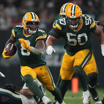 Green Bay Packers running back Josh Jacobs (8) breaks into the clear during the second half against the Philadelphia Eagles on Friday.