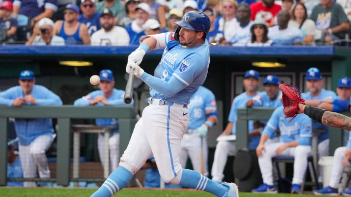 Jul 21, 2024; Kansas City, Missouri, USA; Kansas City Royals first base Vinnie Pasquantino (9) hits a single against the Chicago White Sox in the eighth inning at Kauffman Stadium. Mandatory Credit: Denny Medley-USA TODAY Sports