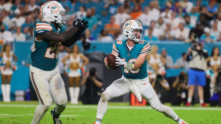 Miami Dolphins quarterback Skylar Thompson (19) fakes a handoff to running back De'Von Achane (28) during the fourth quarter at Hard Rock Stadium on Thursday night.