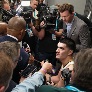 Purdue Boilermakers center Zach Edey (15) answers questions in the locker room Saturday, April 6,