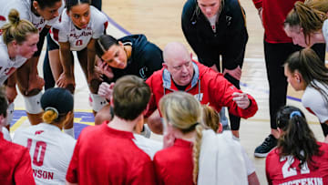 Wisconsin head coach Kelly Sheffield speaks with the players during the second set of their scrimmage match against Marquette on Friday March 31, 2023 at Oconomowoc High School in Oconomowoc, Wis.