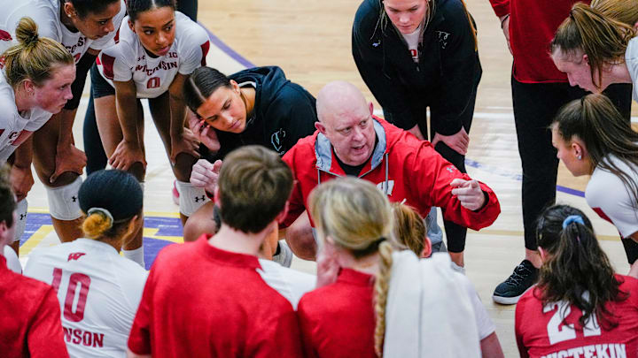 Wisconsin head coach Kelly Sheffield speaks with the players during the second set of their scrimmage match against Marquette on Friday March 31, 2023 at Oconomowoc High School in Oconomowoc, Wis.