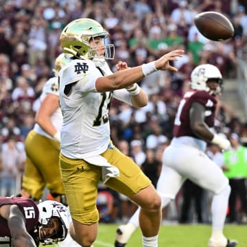 Aug 31, 2024; College Station, Texas, USA; Notre Dame Fighting Irish quarterback Riley Leonard (13) throws a pass under pressure from Texas A&M Aggies quarterback Conner Weigman (15) during the first quarter at Kyle Field. Mandatory Credit: Maria Lysaker-USA TODAY Sports