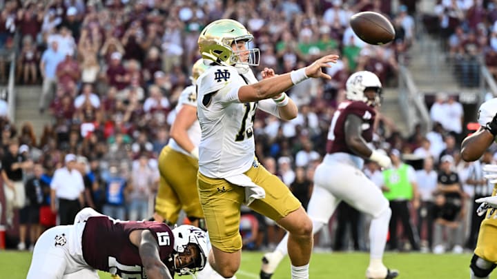 Aug 31, 2024; College Station, Texas, USA; Notre Dame Fighting Irish quarterback Riley Leonard (13) throws a pass under pressure from Texas A&M Aggies quarterback Conner Weigman (15) during the first quarter at Kyle Field. Mandatory Credit: Maria Lysaker-Imagn Images