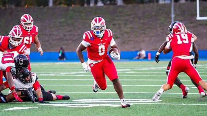 Mater Dei's Jordon Davison carrying the ball against Corona Centennial on Thursday, Aug. 22, 2024.