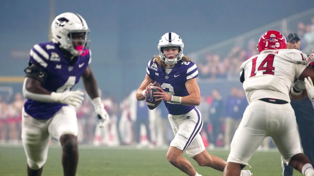 Kansas State quarterback Avery Johnson (2) looks for receivers against Rutgers during first half of the Rate Bowl at Chase Field on Dec. 26, 2024, in Phoenix.