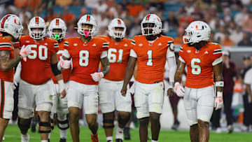Sep 27, 2024; Miami Gardens, Florida, USA; Miami Hurricanes quarterback Cam Ward (1) looks on from the field against the Virginia Tech Hokies during the first quarter at Hard Rock Stadium. Mandatory Credit: Sam Navarro-Imagn Images