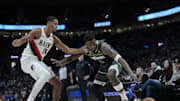 Nov 13, 2024; Portland, Oregon, USA; Minnesota Timberwolves shooting guard Anthony Edwards (5) loses control of the ball against Portland Trail Blazers forward Kris Murray (24) during the second half at Moda Center. Mandatory Credit: Soobum Im-Imagn Images